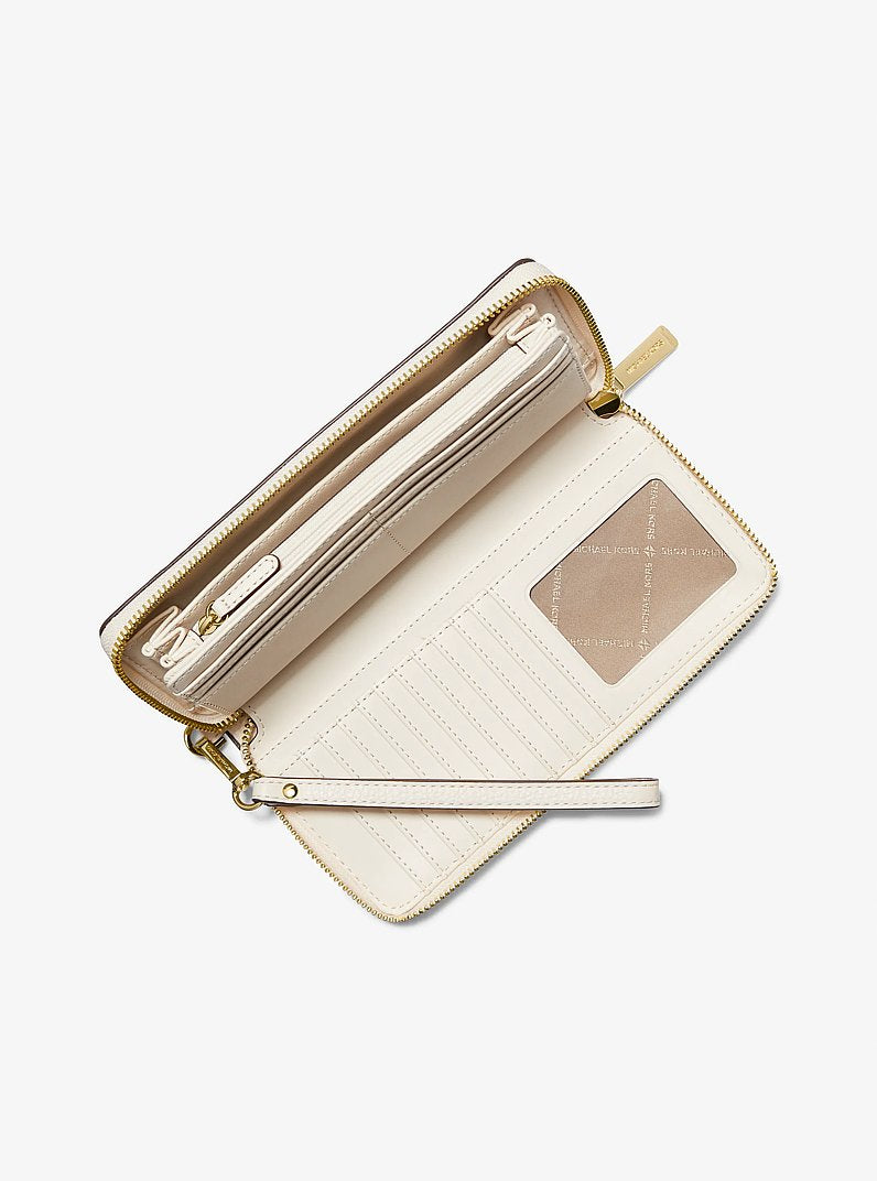 Jet Set Travel Large Pebbled Leather Wristlet Lt Cream Lt Cream