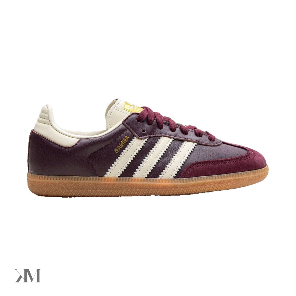 Adidas Samba OG sneaker in maroon leather with gold metallic heel tab and cream stripes