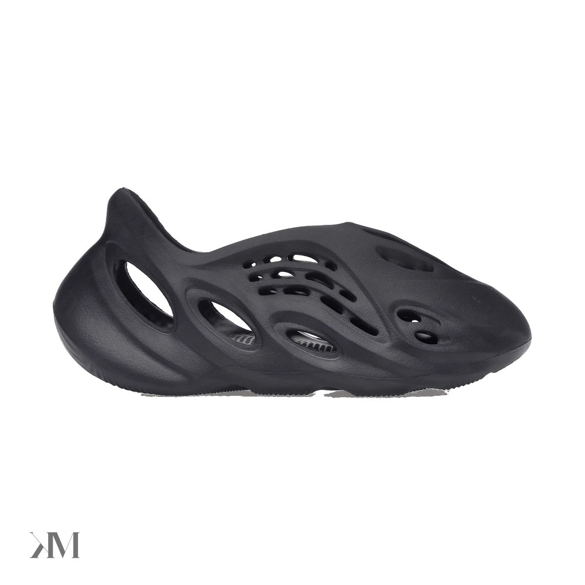Adidas Yeezy Foam RNR Onyx shown as a single piece black foam clog with cut out ventilation and sculpted sole