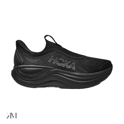 Hoka Skyward Laceless Black Black slip-on recovery shoe with thick midsole and Active Foot Frame, side view