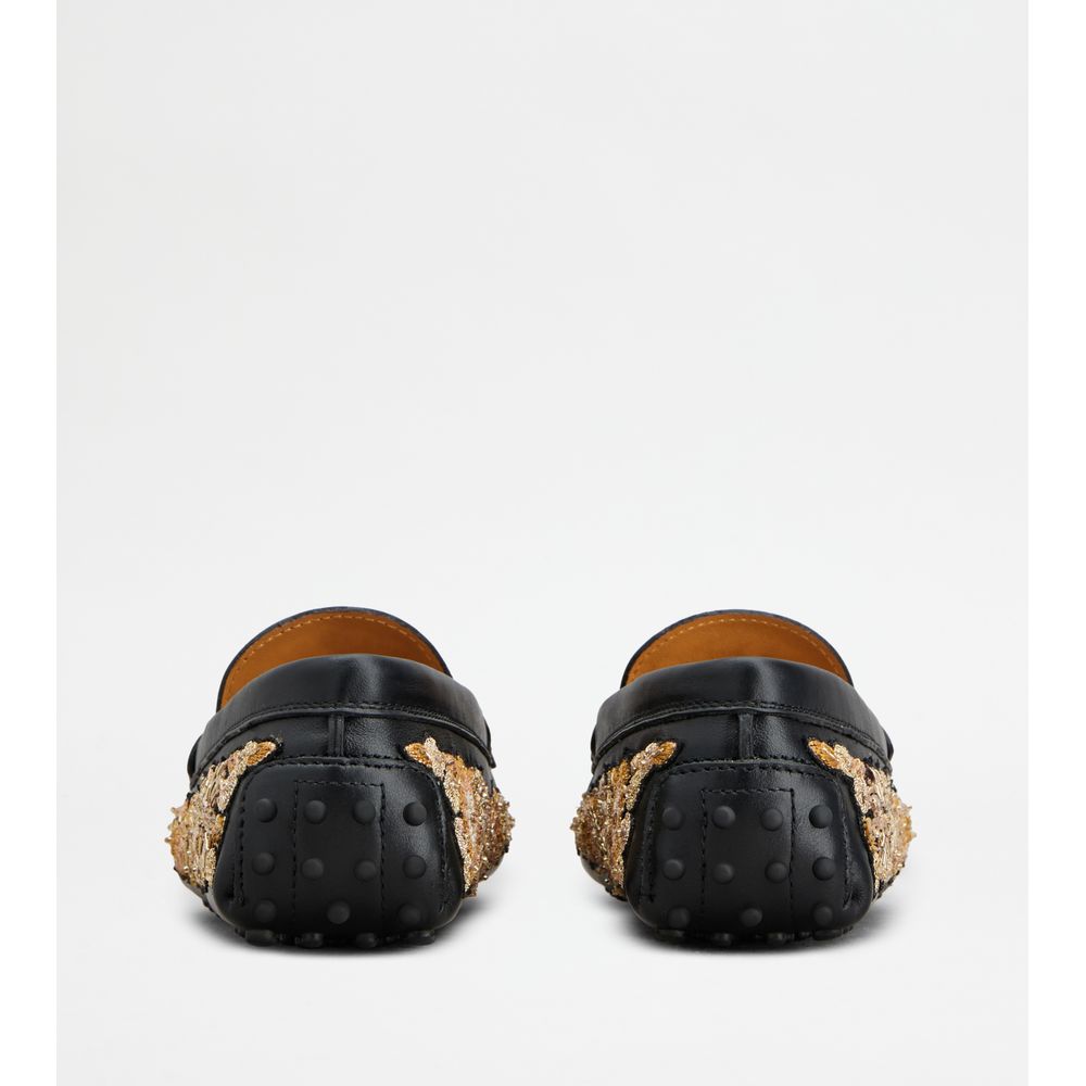 Tods T Timeless Gommino Driving Shoes In Leather Black Gold Womens