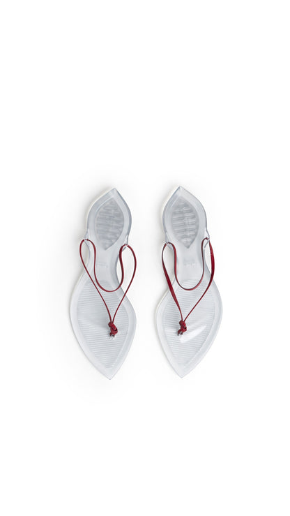 Alaïa Invisible Thong In Patent Leather