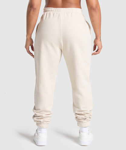 Women's Gymshark Lifting Essentials Graphic Brushed Oversized Joggers Oat White