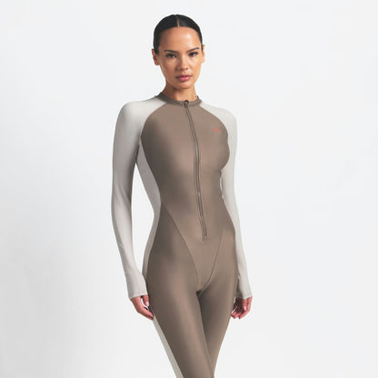 Skims Nikeskims Shine Zip Front Long Onesie Truffle And Stone