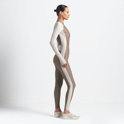 Skims Nikeskims Shine Zip Front Long Onesie Truffle And Stone