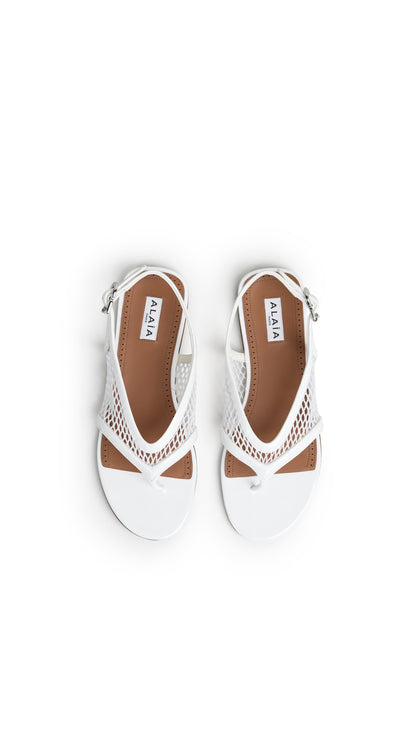 Alaïa Fishnet Thong Sandals In Patent Calfskin