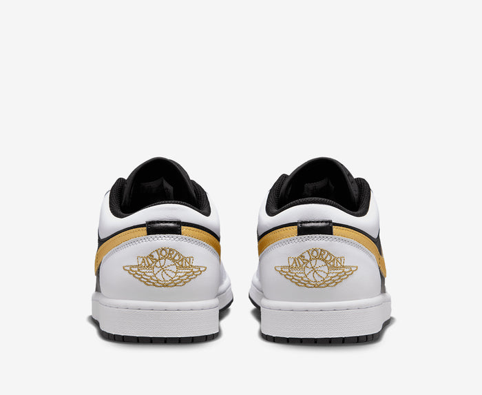 black and white nikes with gold swoosh