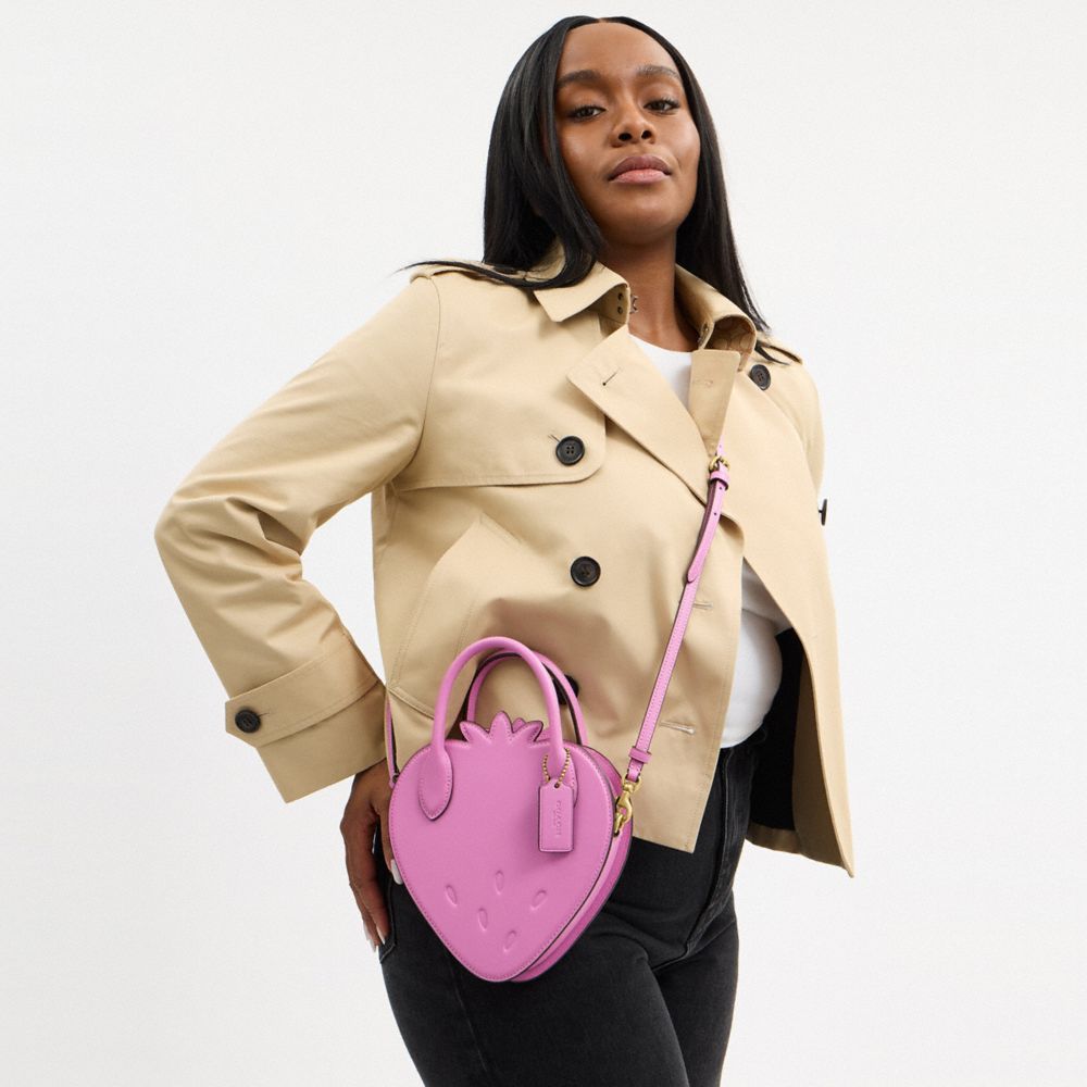 Coach Strawberry Bag In Regenerative Leather Brass Fuschia