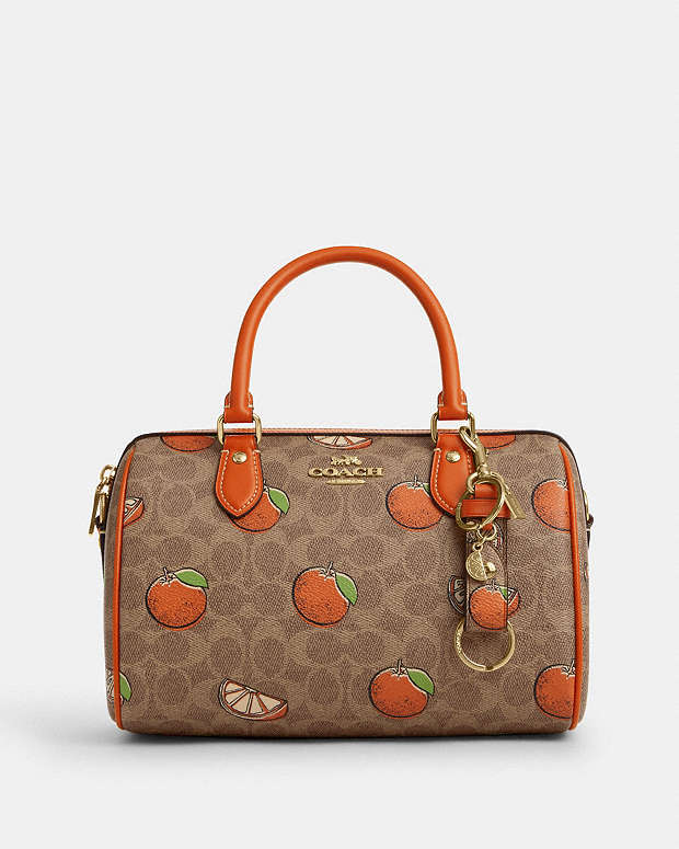 Trigger Snap Bag Charm In Signature Canvas With Orange Print Signature Canvas-Gold-Tan Multi Signature Canvas-Gold-Tan Multi