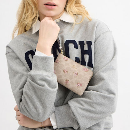 Coach Corner Zip Wristlet In Signature Canvas With Floral Print Gold Sand Multi