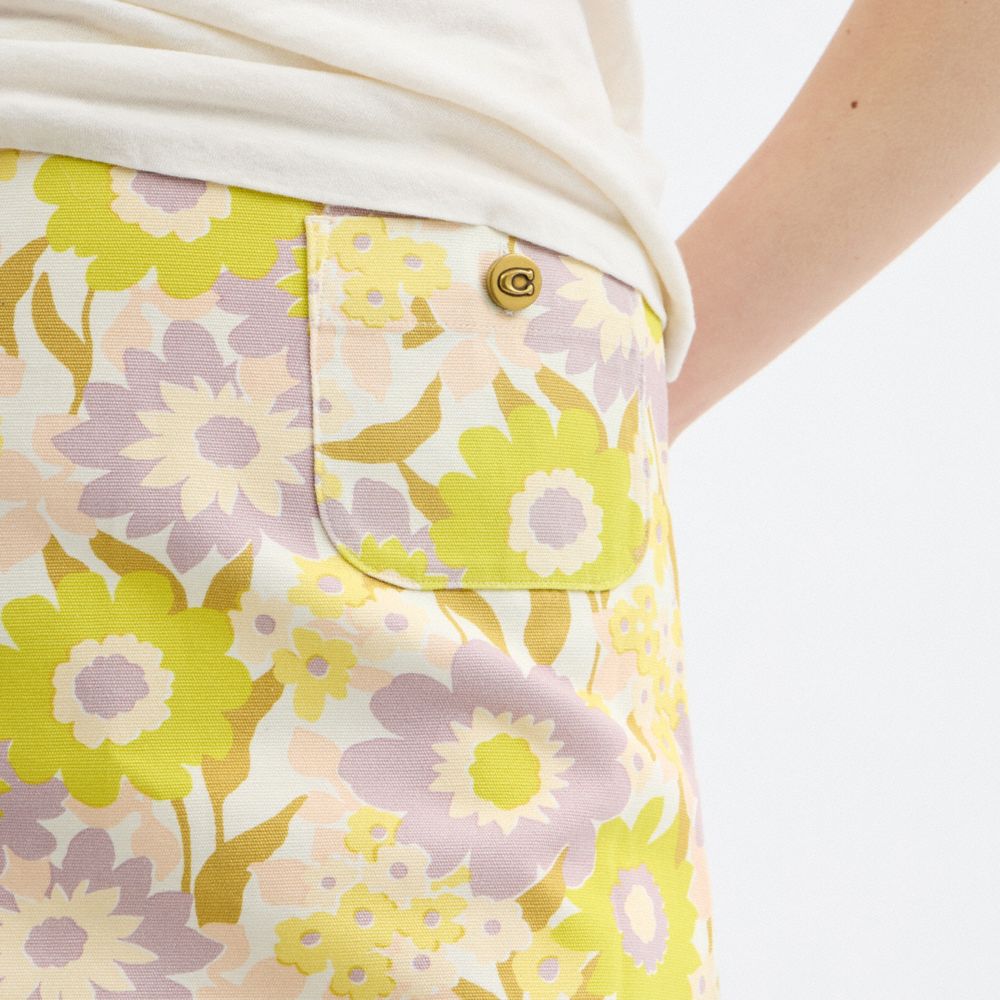 Coach Cotton Canvas Mini Skirt In Regenerative Cotton Yellow Floral