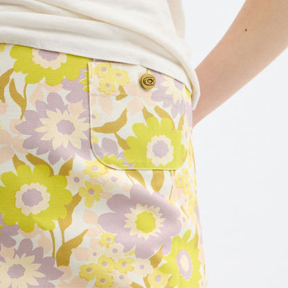 Coach Cotton Canvas Mini Skirt In Regenerative Cotton Yellow Floral