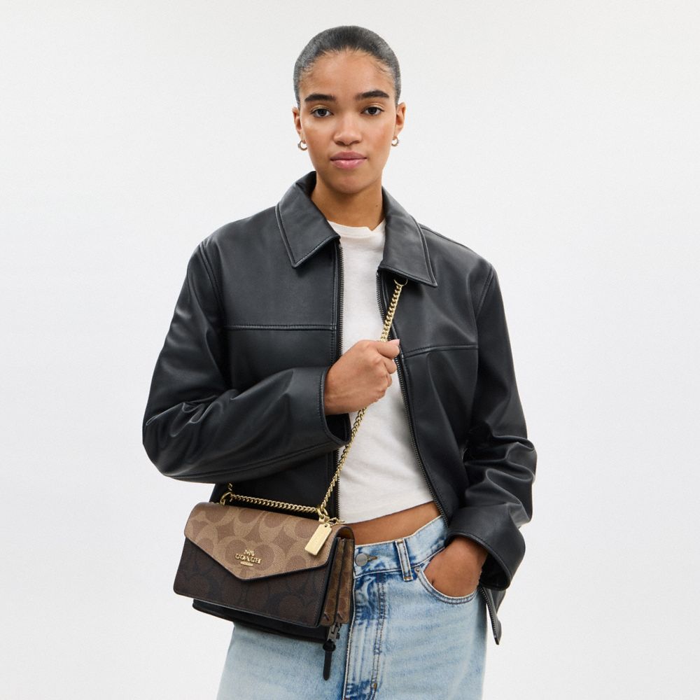 Coach Klare Envelope Crossbody Bag In Blocked Signature Canvas Gold Walnut Tan