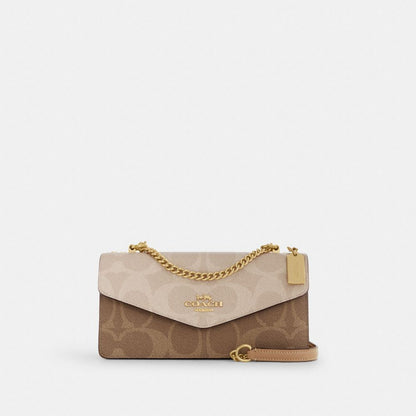 Coach Klare Envelope Crossbody Bag In Blocked Signature Canvas Gold Sand Tan