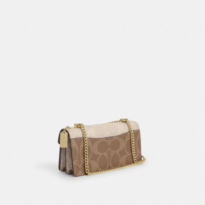 Coach Klare Envelope Crossbody Bag In Blocked Signature Canvas Gold Sand Tan