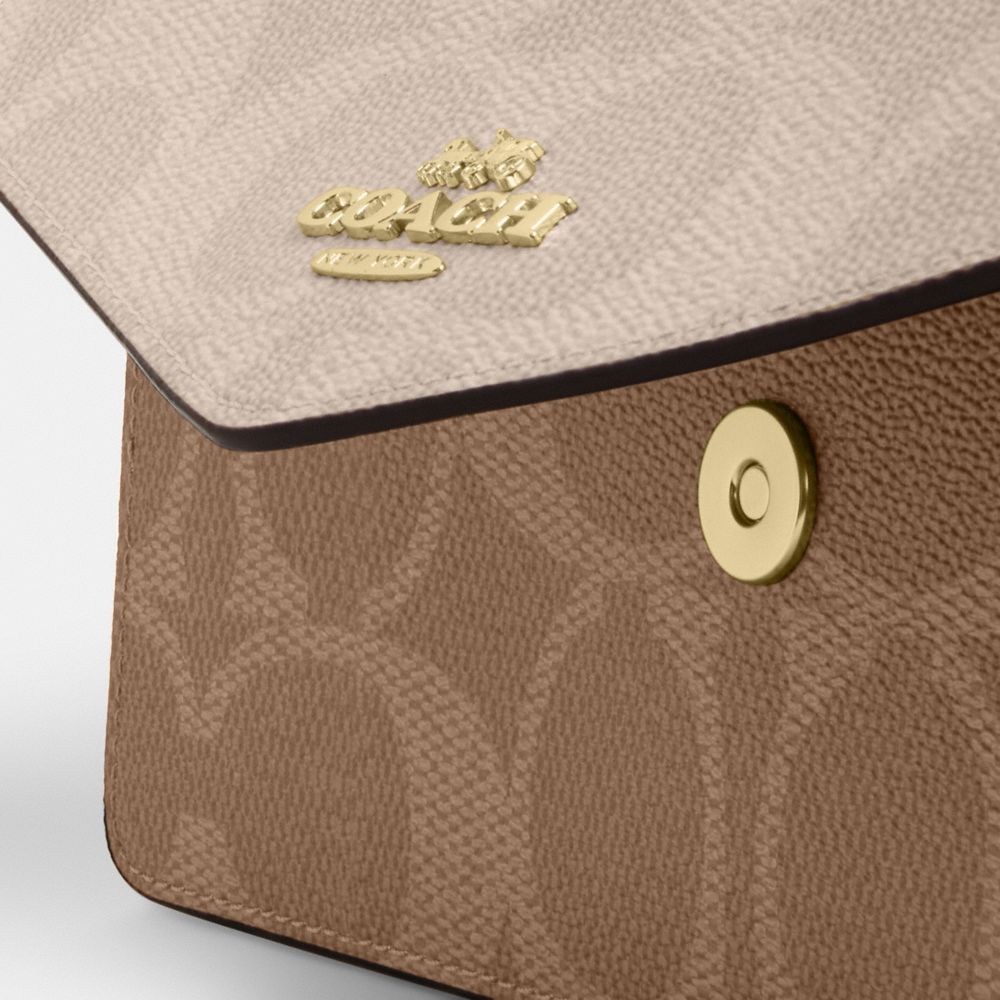 Coach Klare Envelope Crossbody Bag In Blocked Signature Canvas Gold Sand Tan