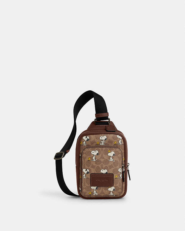 Coach X Peanuts Racer Sling Pack In Signature Canvas With Snoopy Print Signature Canvas-Gunmetal-Tan Multi Signature Canvas-Gunmetal-Tan Multi