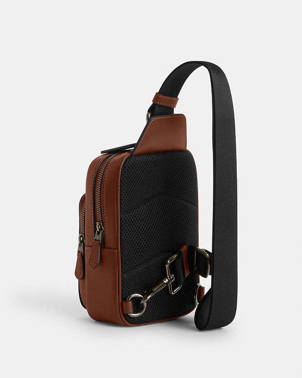 Coach X Peanuts Racer Sling Pack In Signature Canvas With Snoopy Print Signature Canvas-Gunmetal-Tan Multi Signature Canvas-Gunmetal-Tan Multi