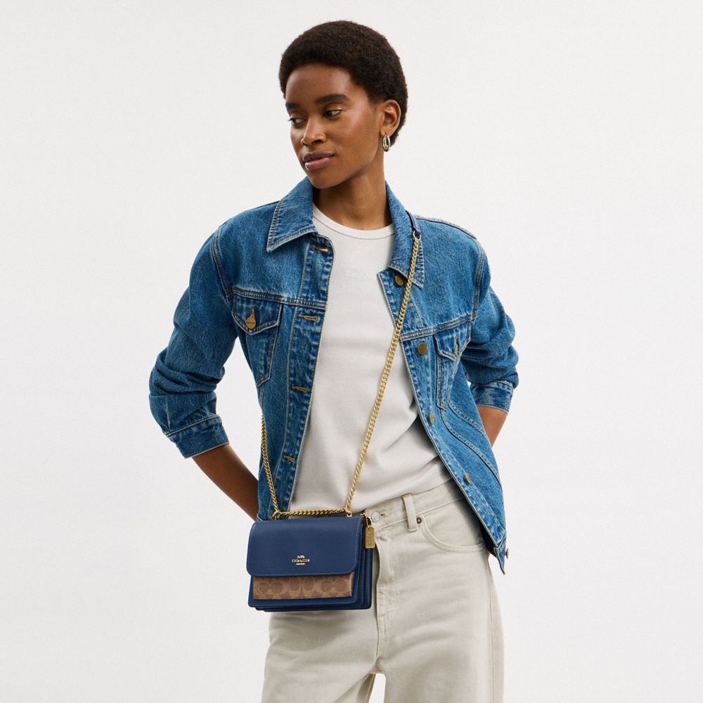 Coach Mini Klare Crossbody Bag In Signature Canvas Im Deep Blue Tan