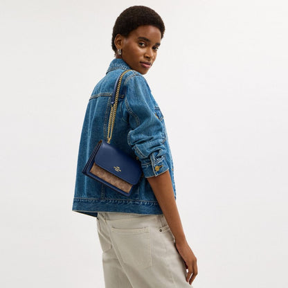 Coach Mini Klare Crossbody Bag In Signature Canvas Im Deep Blue Tan