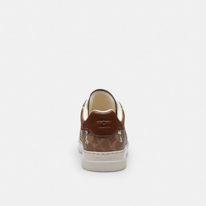 Coach Coach X Peanuts High Line Sneaker In Signature Canvas With Snoopy Print Tan