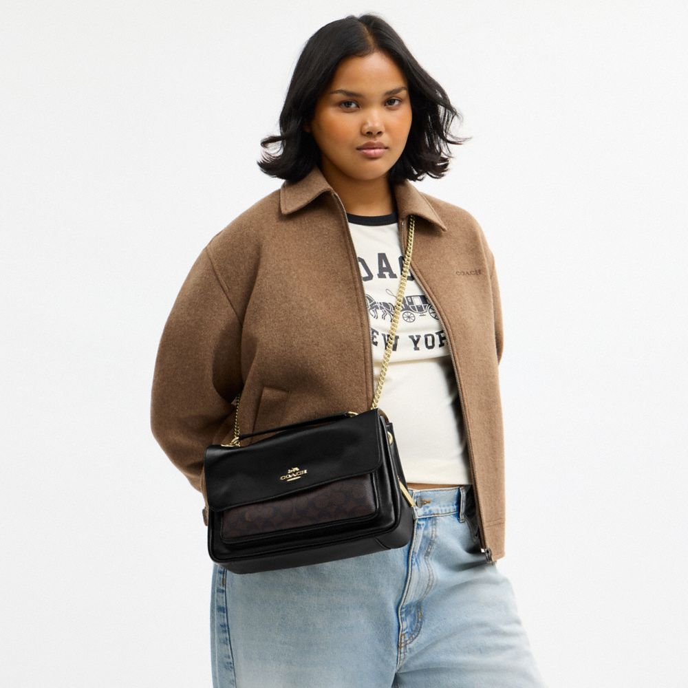 Coach Elodie Crossbody Bag In Signature Canvas Gold Walnut Black