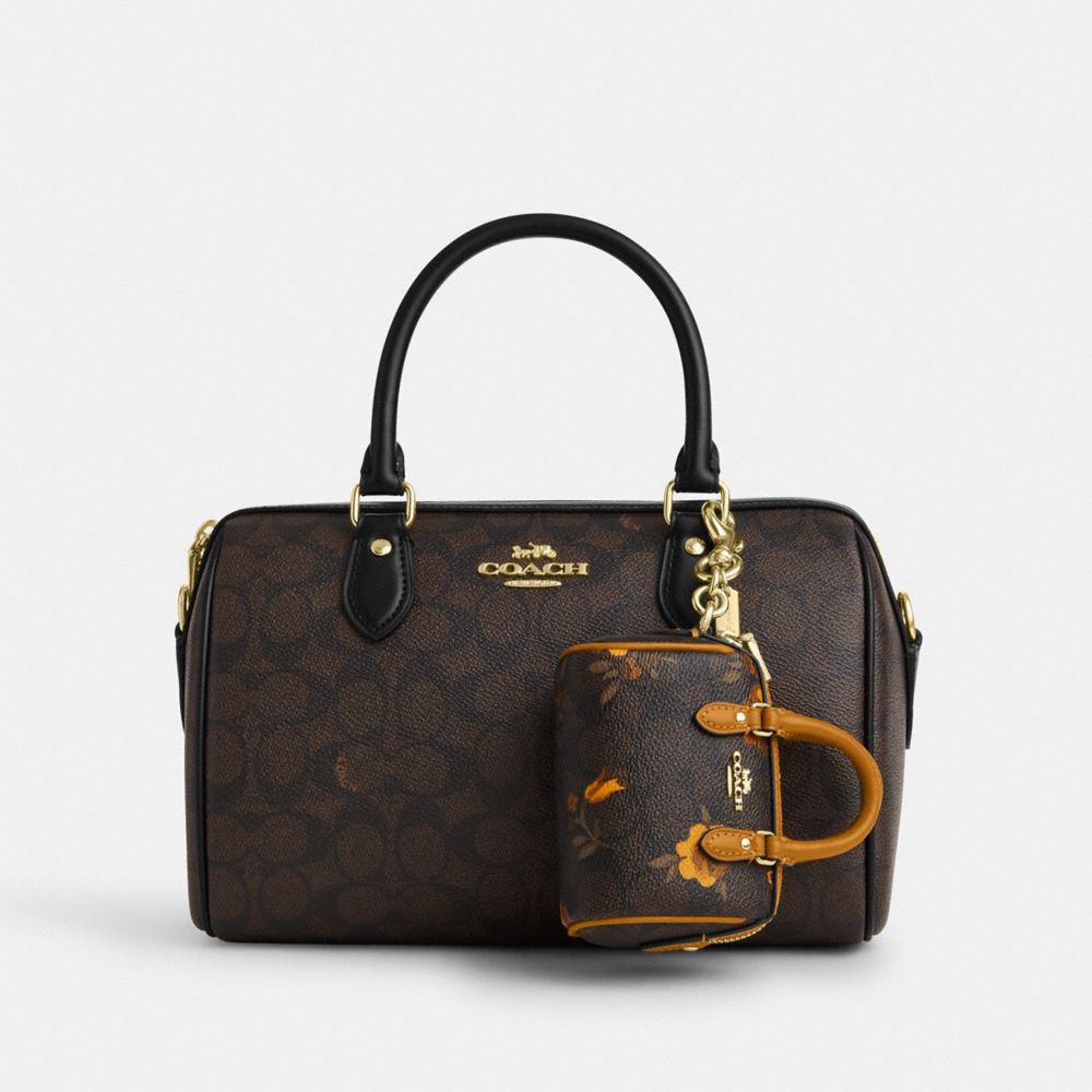 Coach Mini Rowan Bag Charm In Signature Canvas With Floral Print Im Walnut Yellow
