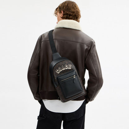 Coach West Pack In Signature Canvas With Varsity Graphic Qb Walnut Multi