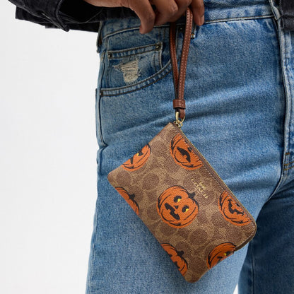 Coach Corner Zip Wristlet In Signature Canvas With Halloween Print Gold Tan Multi