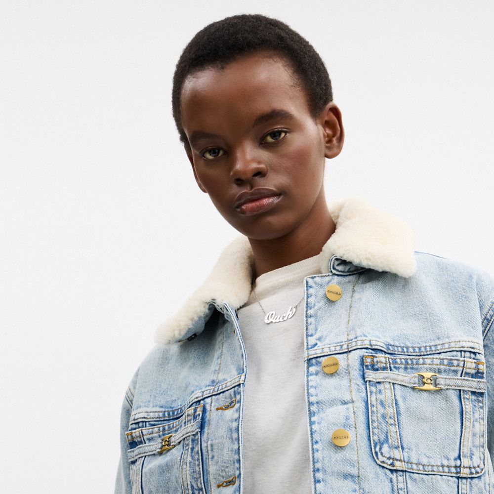Coach Cropped Heritage C Denim Trucker Jacket In Organic Cotton With Shearling Collar Light Blue Denim