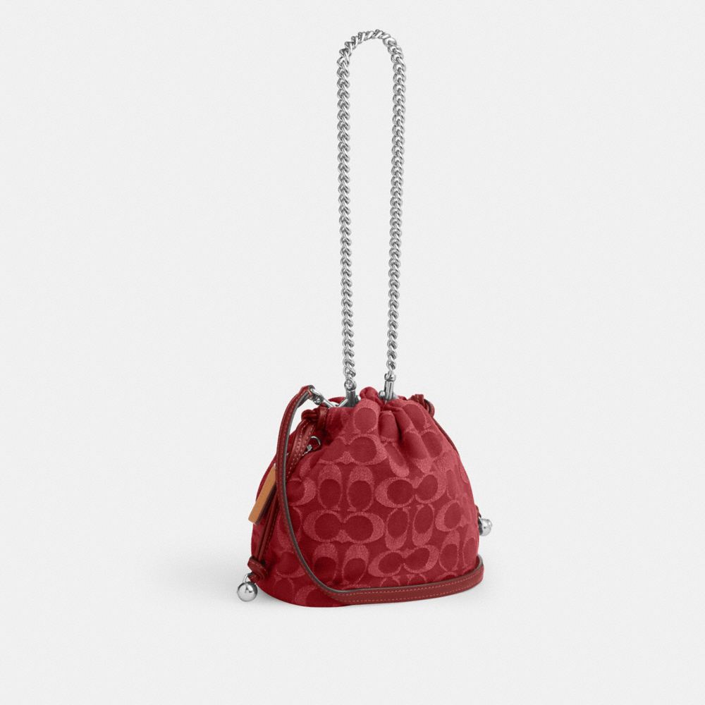 Coach Faye Mini Drawstring Bag In Signature Denim Silver True Red