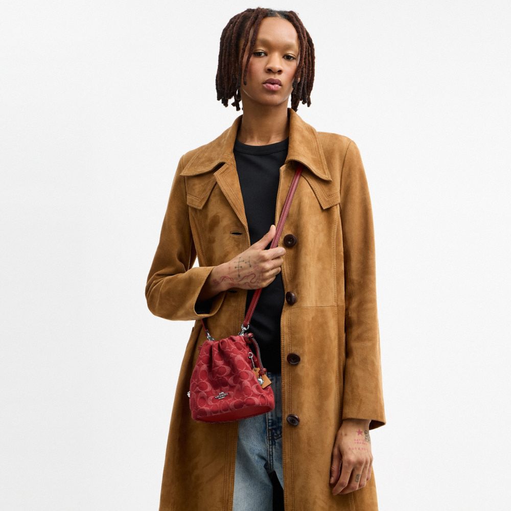 Coach Faye Mini Drawstring Bag In Signature Denim Silver True Red