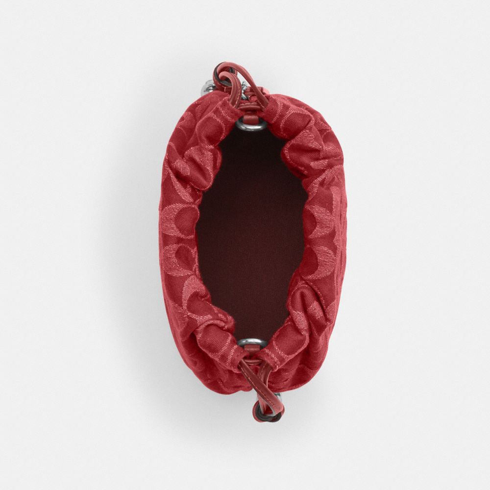 Coach Faye Mini Drawstring Bag In Signature Denim Silver True Red