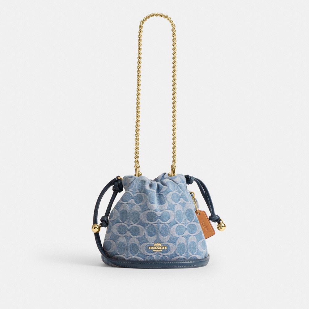 Coach Faye Mini Drawstring Bag In Signature Denim Gold Indigo