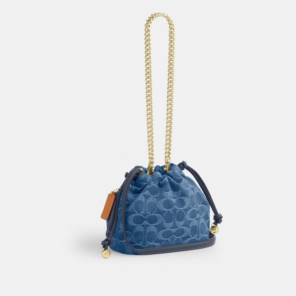 Coach Faye Mini Drawstring Bag In Signature Denim Gold Indigo