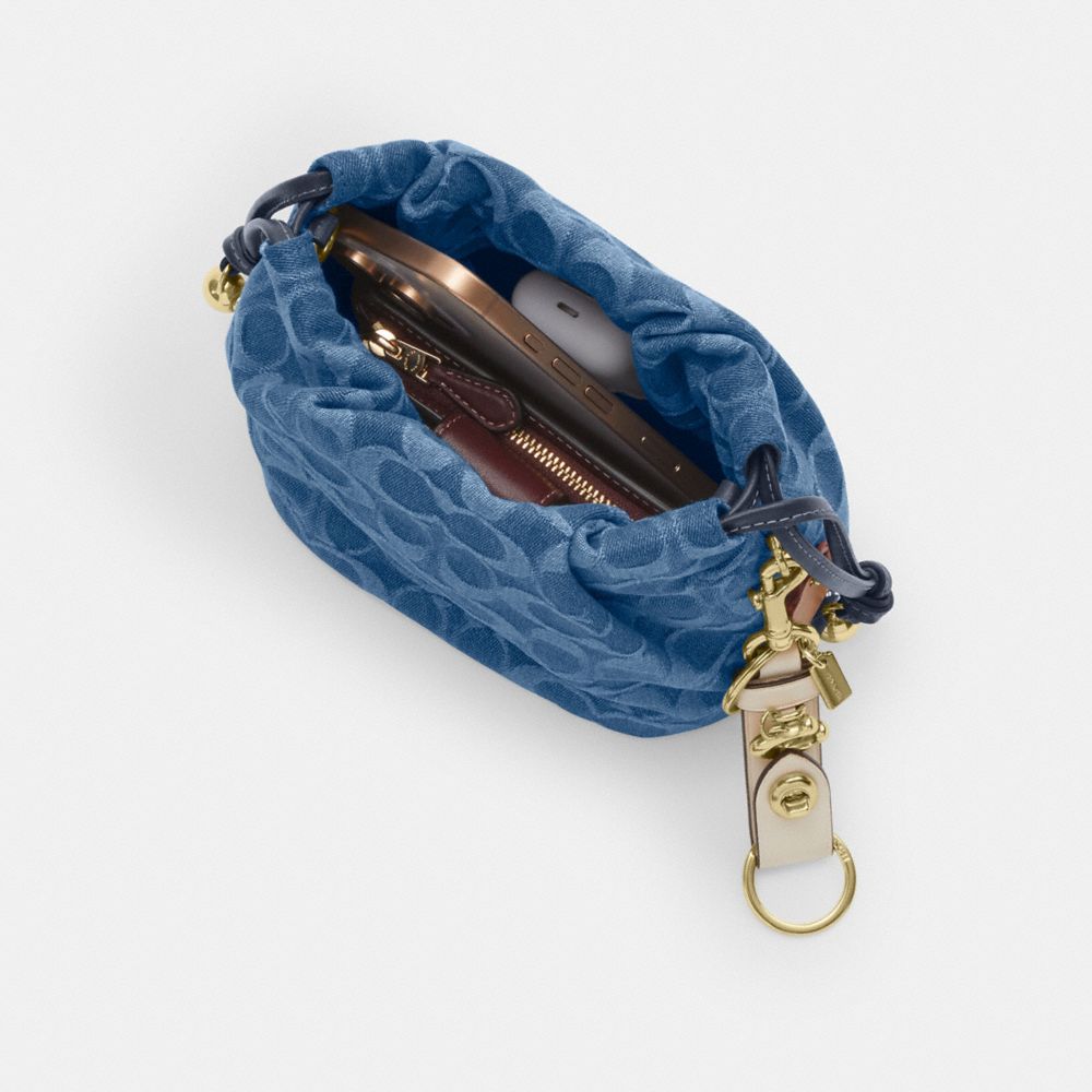 Coach Faye Mini Drawstring Bag In Signature Denim Gold Indigo