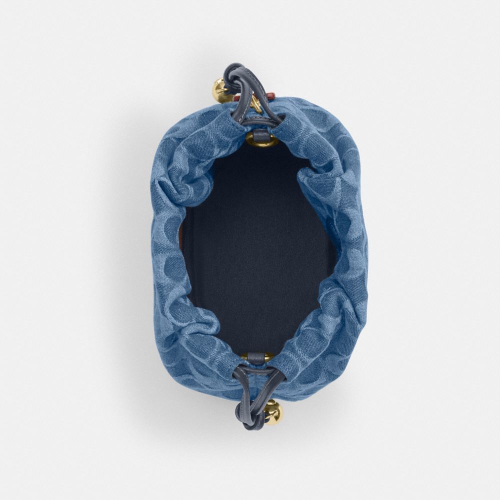 Coach Faye Mini Drawstring Bag In Signature Denim Gold Indigo