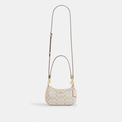 Coach Teri Mini Crossbody Bag In Signature Canvas Gold Chalk Pink