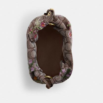 Coach Faye Mini Drawstring Bag In Signature Jacquard With Floral Embroidery Gold Oak Multi