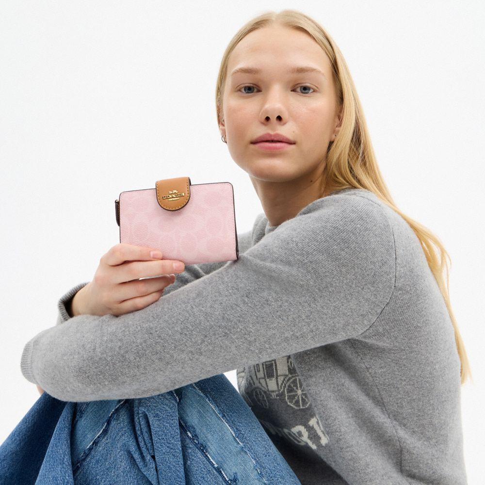 Coach Medium Corner Zip Wallet In Signature Canvas Gold Powder Pink