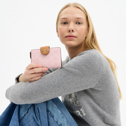 Coach Medium Corner Zip Wallet In Signature Canvas Gold Powder Pink