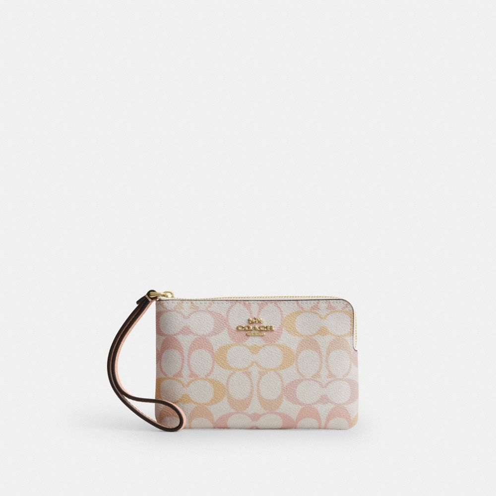 Coach Corner Zip Wristlet In Signature Canvas Gold Chalk Pink
