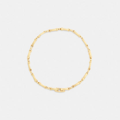 Coach Bow Chain Linear Bracelet Gold