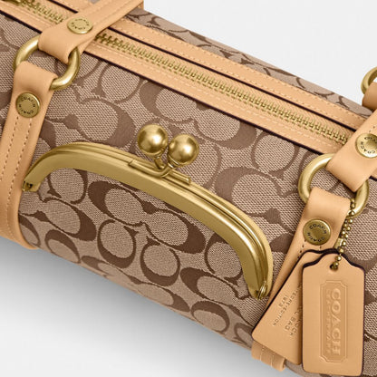 Coach Kisslock Barrel Bag 28 In Signature Jacquard Brass/Khaki Light Peach