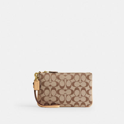 Coach Essential Small Wristlet In Signature Jacquard Brass Khaki Light Peach