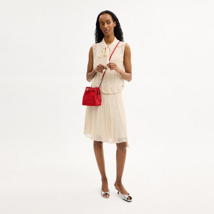 Coach Jade Drawstring Bag Brass/Candy Apple