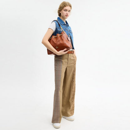 Coach Evelyn Shoulder Bag With Quilting And Charm Gold Cinnamon