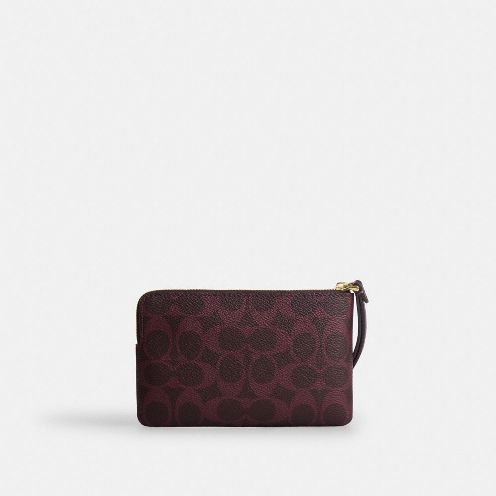 Coach Corner Zip Wristlet In Signature Canvas Gold/Black Currant
