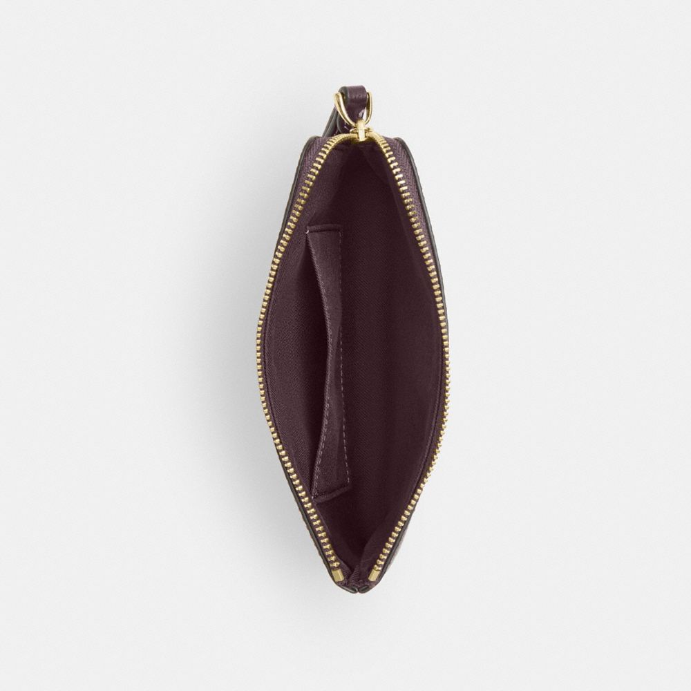 Coach Corner Zip Wristlet In Signature Canvas Gold/Black Currant