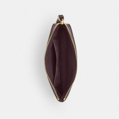 Coach Corner Zip Wristlet In Signature Canvas Gold/Black Currant